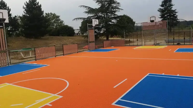 Flexcourt MUGA in orange with blue, white and yellow markings