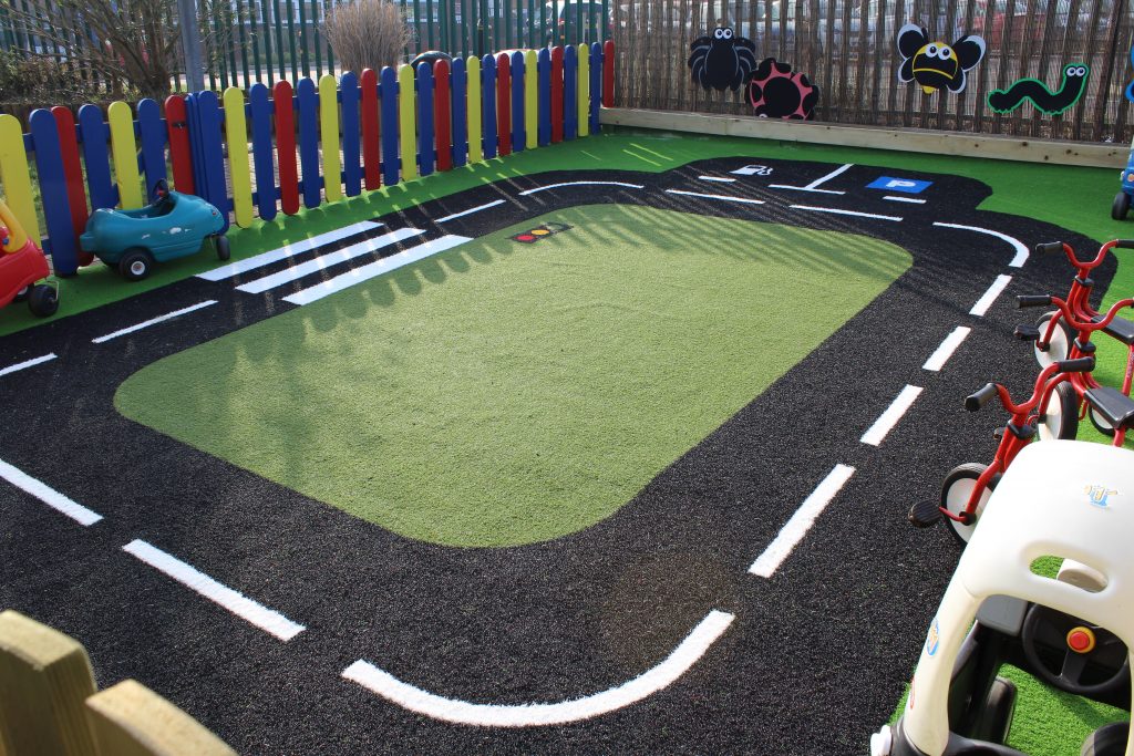 race track designed on velour grass surface in a nursery