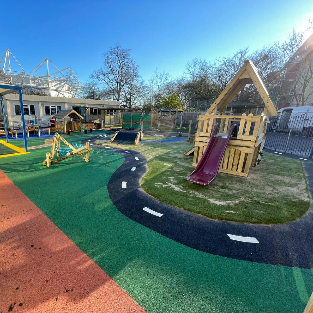 Playground race track and play structure